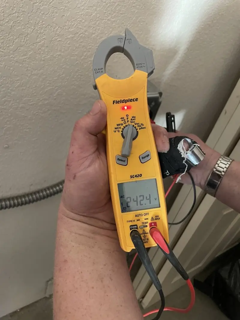 Voltage testing with clamp meter during Whole House Surge Protector in Greenfield